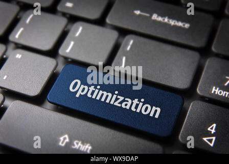 Blue key with Optimization word on laptop keyboard. Included clipping path, so you can easily edit it. Stock Photo