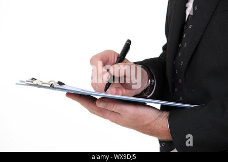 Writing on a clipboard Stock Photo