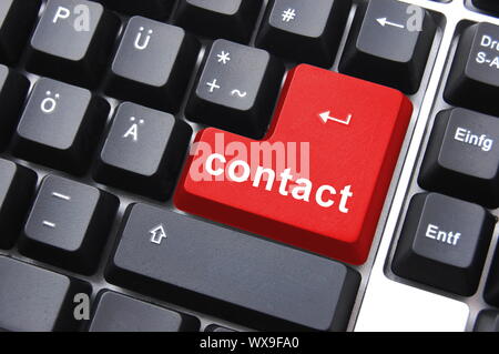 contact text written on a computer keyboard Stock Photo