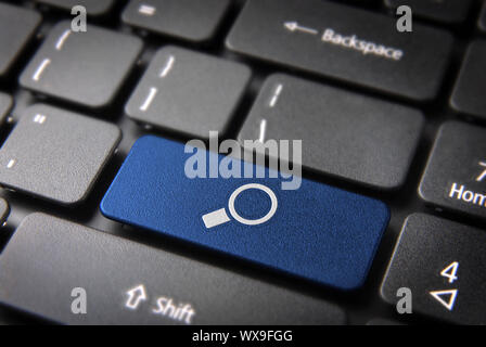 Internet search key with magnifying glass icon on laptop keyboard. Included clipping path, so you can easily edit it. Stock Photo