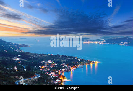 Night summer coastline and village  on seashore (Peljesac  peninsula, Croatia). Stock Photo