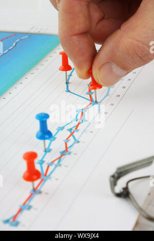 Graphs tables and documents laid on the table Stock Photo