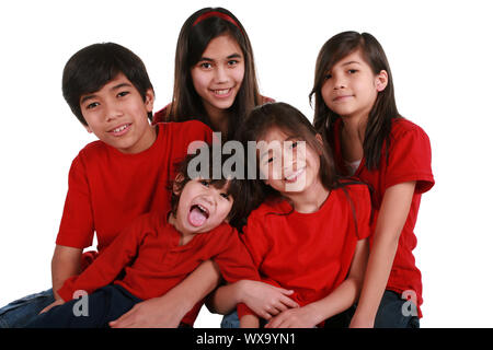 Five siblings with red shirts isolated on white Stock Photo