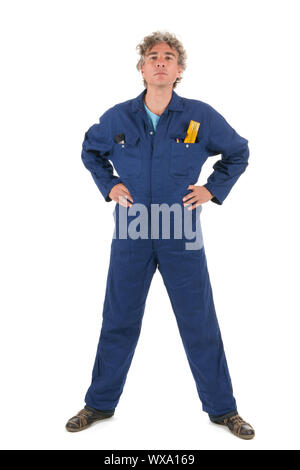 Handsome handyman in blue overall ready for the job Stock Photo