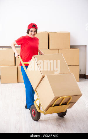 Young female professional mover doing home relocation Stock Photo