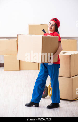 Young female professional mover doing home relocation Stock Photo