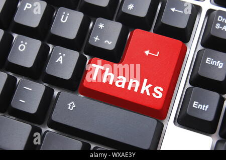 thanks written on computer button to say thank you Stock Photo