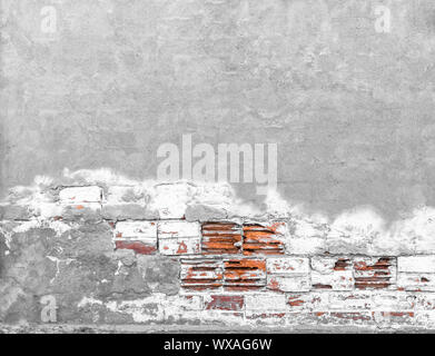 Brick wall with chipped plaster Stock Photo