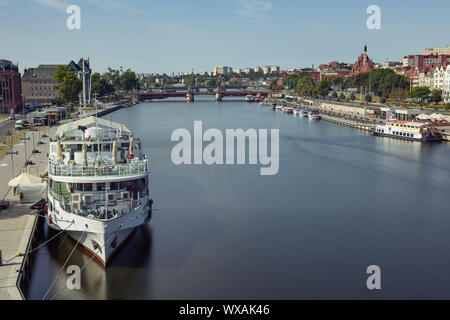 Cityscape with Odra river. Szczecin historical city with architectural layout similar to Paris. Castle of Pomeranian dukes in Szczecin and Basilica of Stock Photo