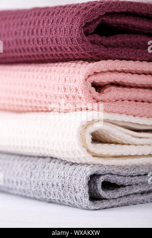 Stack of colorful cotton kitchen towels vertical Stock Photo
