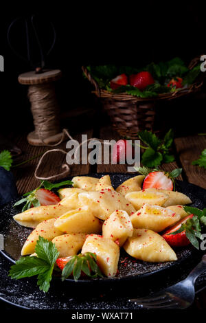 Kopytka - polish potato dumpling with strawberries Stock Photo