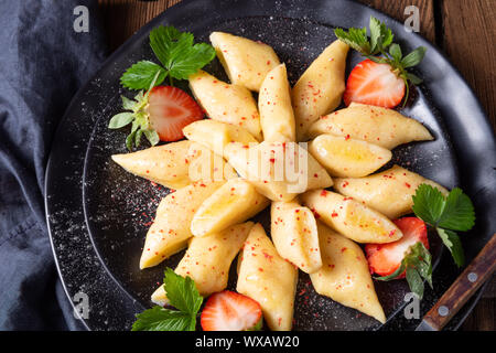 Kopytka - polish potato dumpling with strawberries Stock Photo