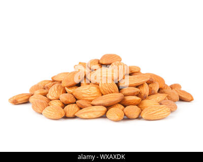 A pile of dried almonds isolated on white background Stock Photo