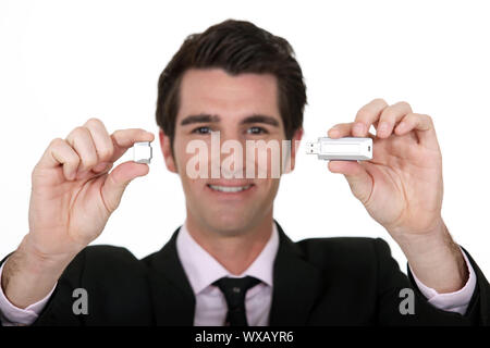 Man holding USB memory stick Stock Photo