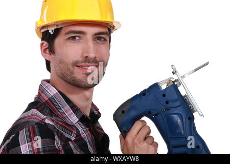 Man holding band-saw Stock Photo