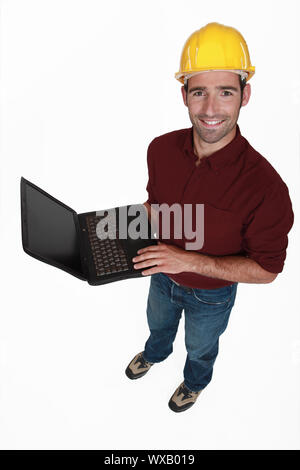 Engineer with a laptop Stock Photo