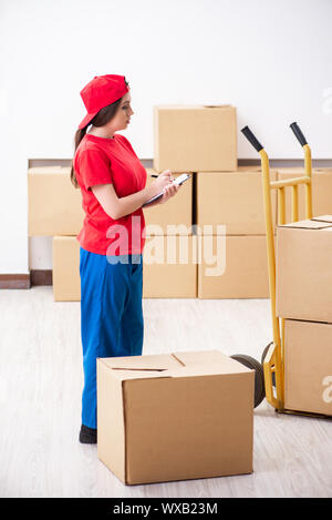 Young female professional mover doing home relocation Stock Photo