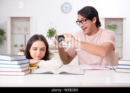 Students preparing for exam together at home Stock Photo