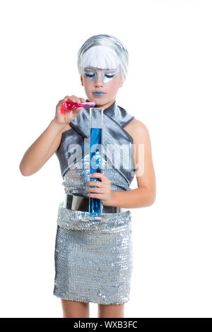 children futuristic fashion children silver girl doing chemical laboratory experiment Stock Photo