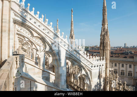 White statue on top of Duomo cathedral Stock Photo