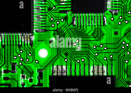Green transparent circuit board with microchips Stock Photo