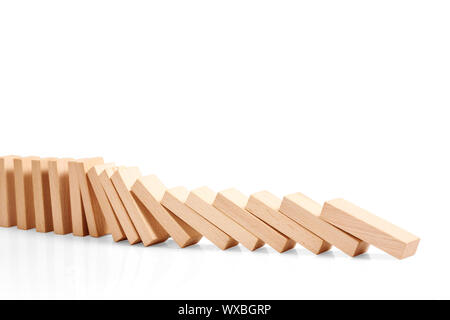 Domino effect stopped by a unique, one strong piece, business idea Stock Photo