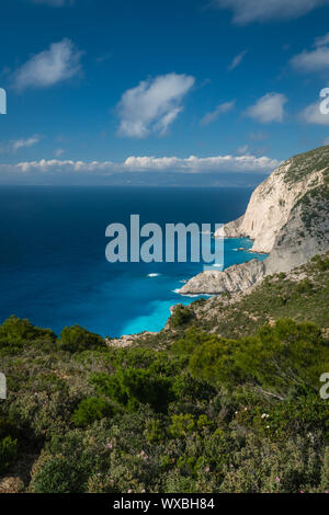 Cliffs above clear turquoise waters of Shipwreck Cove Stock Photo