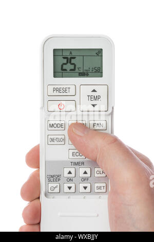 Remote control from air conditioner in hand Stock Photo