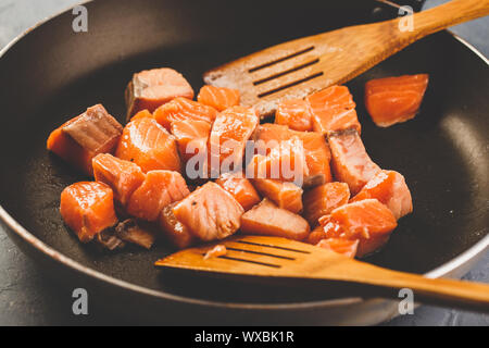 Salmon fillets in frying pan Stock Photo