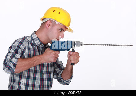 Man using power drill Stock Photo