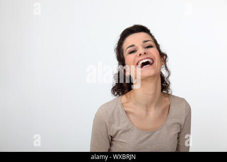 Gorgeous woman laughing out loud Stock Photo