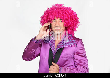 A group of disco girls in African American wigs and colorful costumes on a  white background. Fashion of the seventies and eighties Stock Photo - Alamy