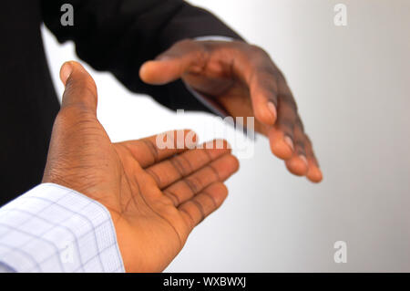 This is an image of a two hands about to perform a handshake. Stock Photo