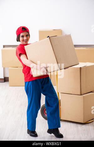 Young female professional mover doing home relocation Stock Photo