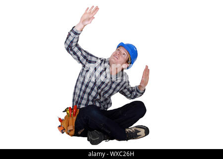Laborer gesturing, studio shot Stock Photo