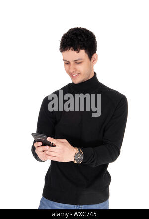 Happy young man smiling over the message on his phone Stock Photo