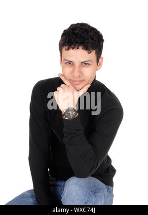 Handsome good looking man sitting on chair Stock Photo