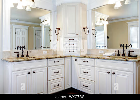 Luxury large white master bathroom cabinets with double sinks. Stock Photo