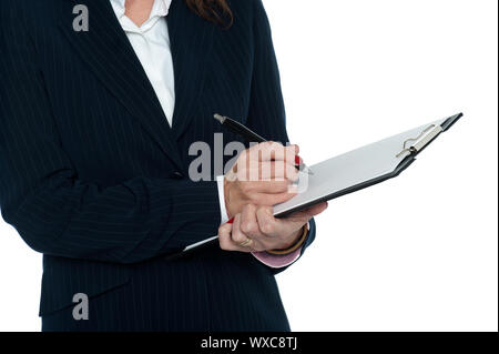 Cropped image of female secretary taking notes from her boss. Stock Photo