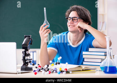 Young male student in the classroom Stock Photo