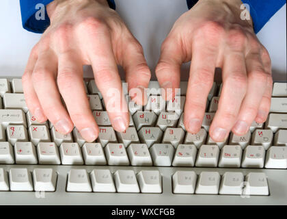 Fingers type a text on the computer keyboard Stock Photo