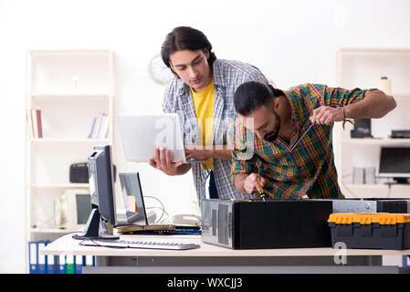 IT engineers working on hardware issue Stock Photo