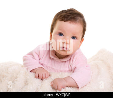 baby girl  dress in pink with winter white fur background Stock Photo