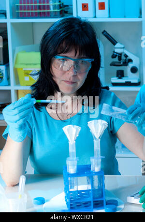 female scientist make maxiprep in the lab Stock Photo