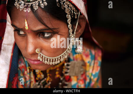 Portrait of Traditional Indian woman in sari costume covered her face with veil, India Stock Photo