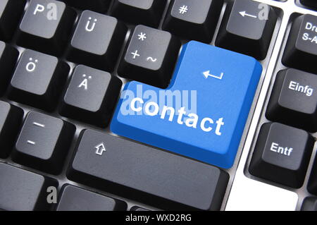contact text written on a computer keyboard Stock Photo