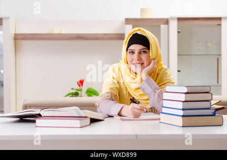 Female student in hijab preparing for exams Stock Photo