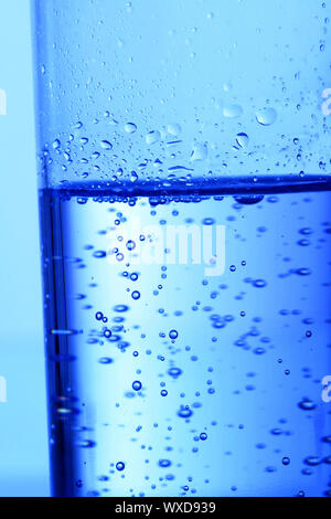 blue bubbled water in glass Stock Photo