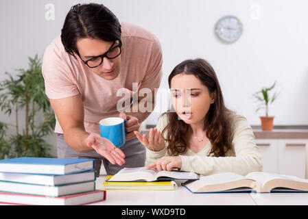 Students preparing for exam together at home Stock Photo