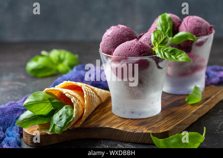 Homemade blueberry ice cream with basil. Stock Photo